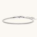 Silver stainless steel tennis bracelet with a single row of clear round zircon stones, lobster clasp, and adjustable extender chain.