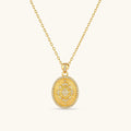 Oval gold coin pendant with pave CZ mandala motif and beaded border on an 18K gold-plated cable chain.